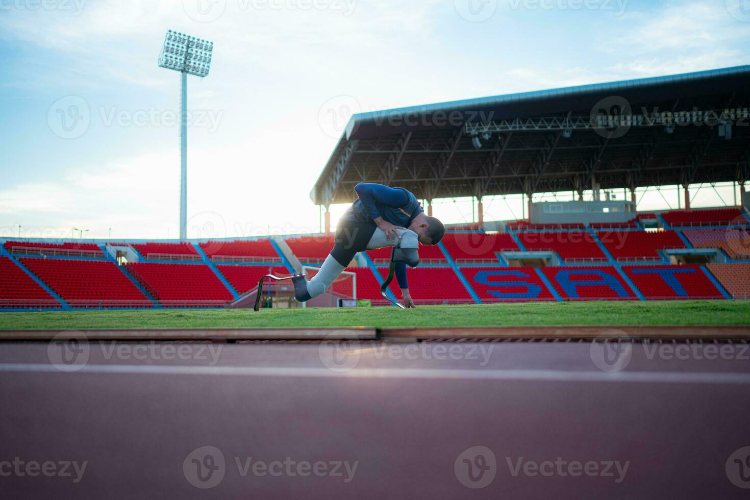 Athletes with disabilities take a break at the stadium between training sessions. photo