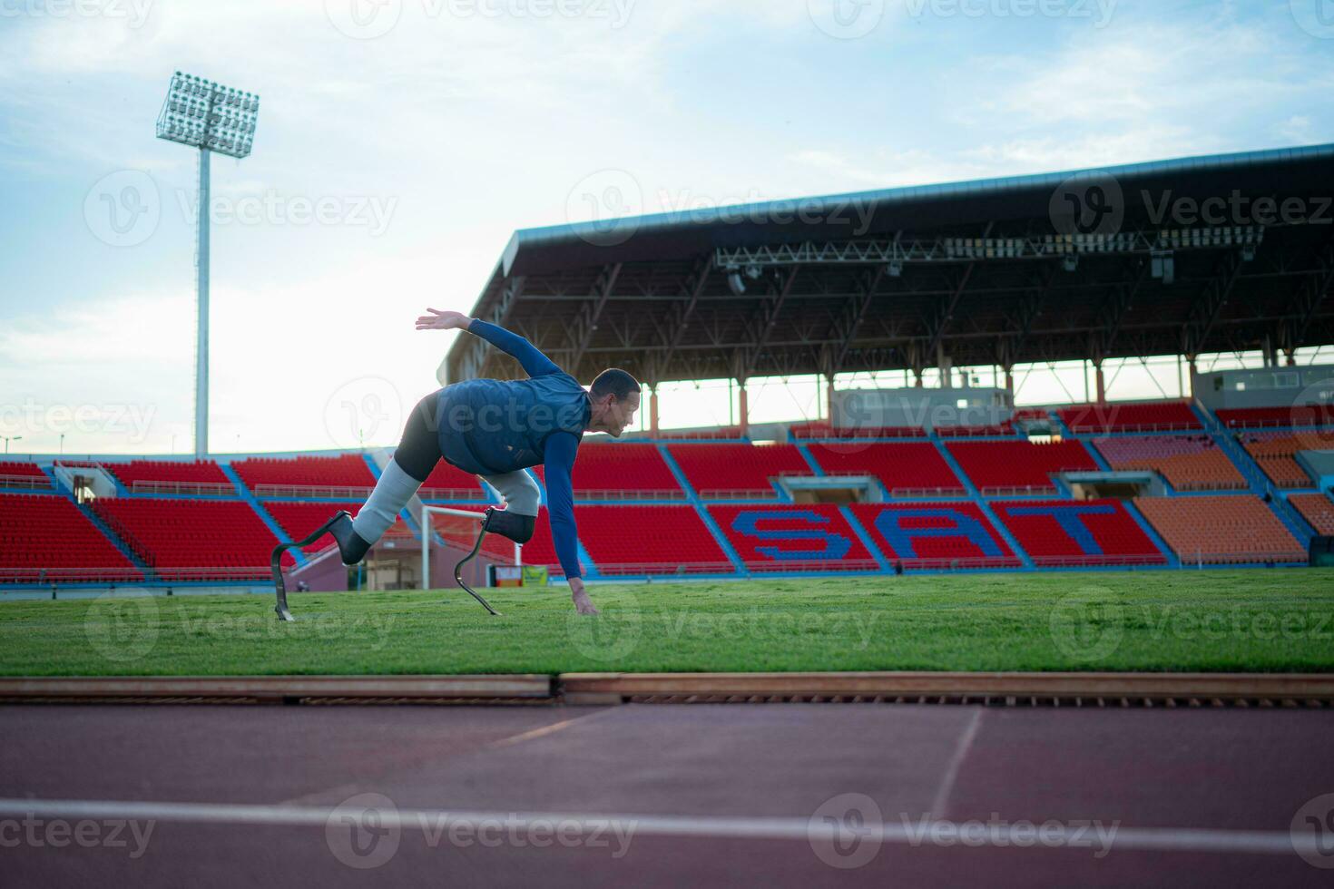 Athletes with disabilities take a break at the stadium between training sessions. photo