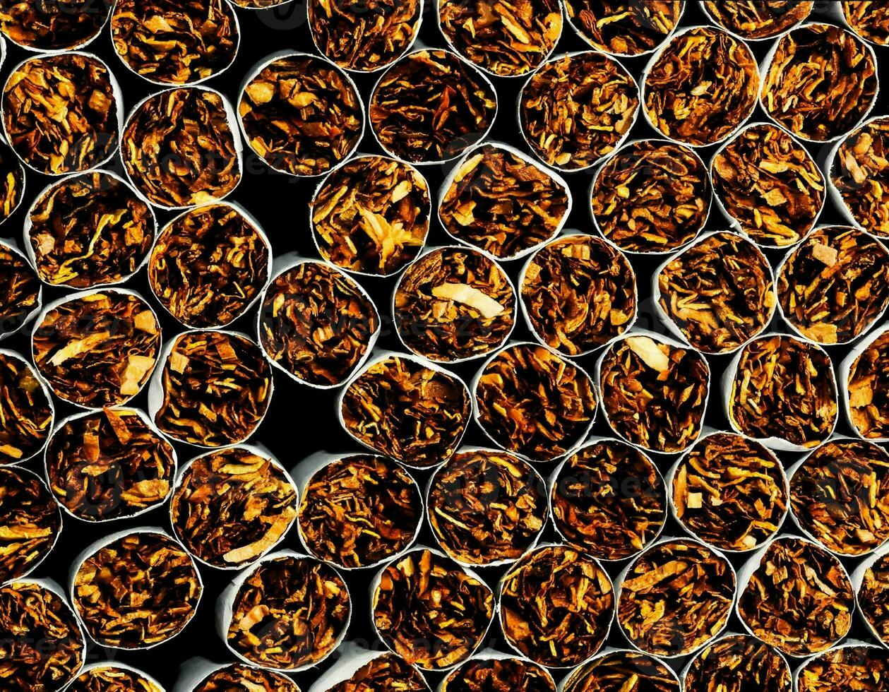 a close up of a pile of cigarettes photo