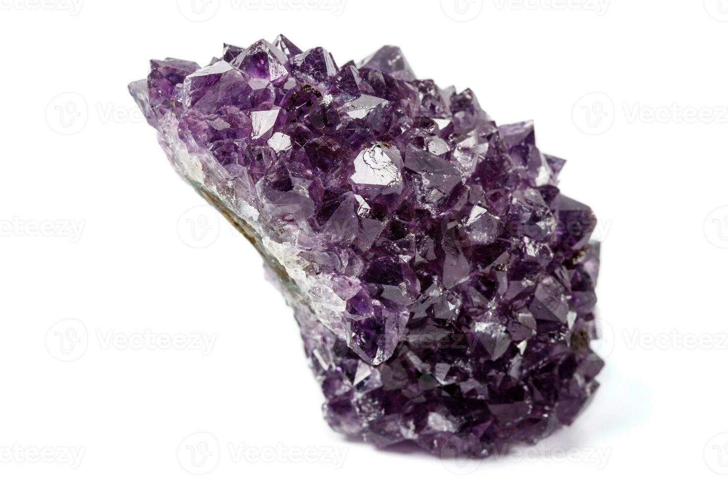 Macro mineral stone Amethysts eye crystals on white background photo