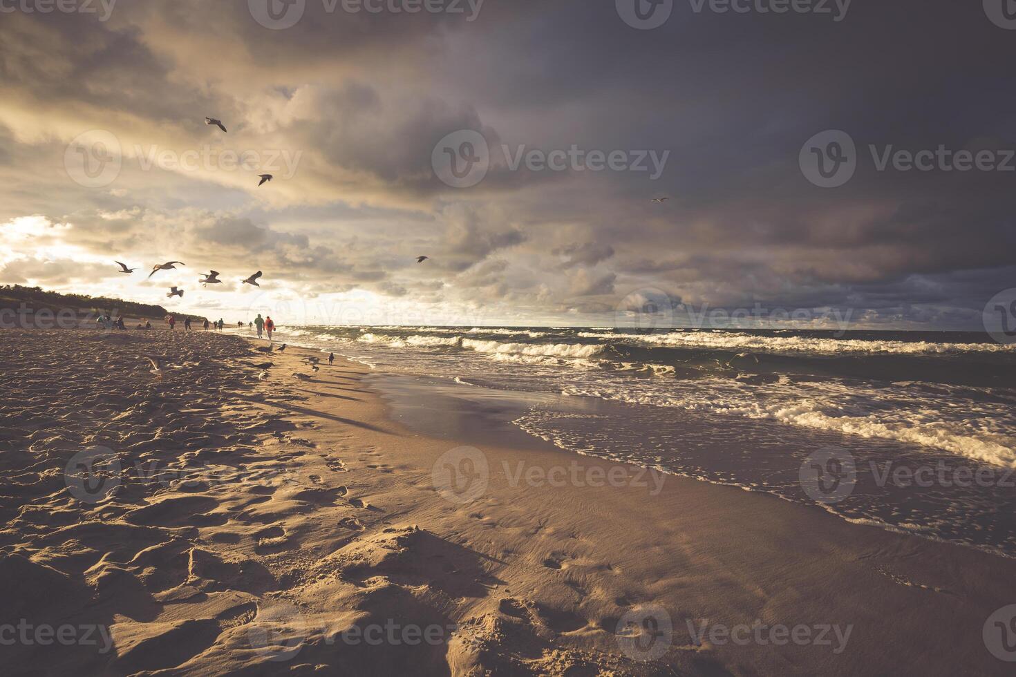 Seascape with dark, dramatic, stormy cumulonimbus cloud formation over the beach at Baltic sea Poland. photo