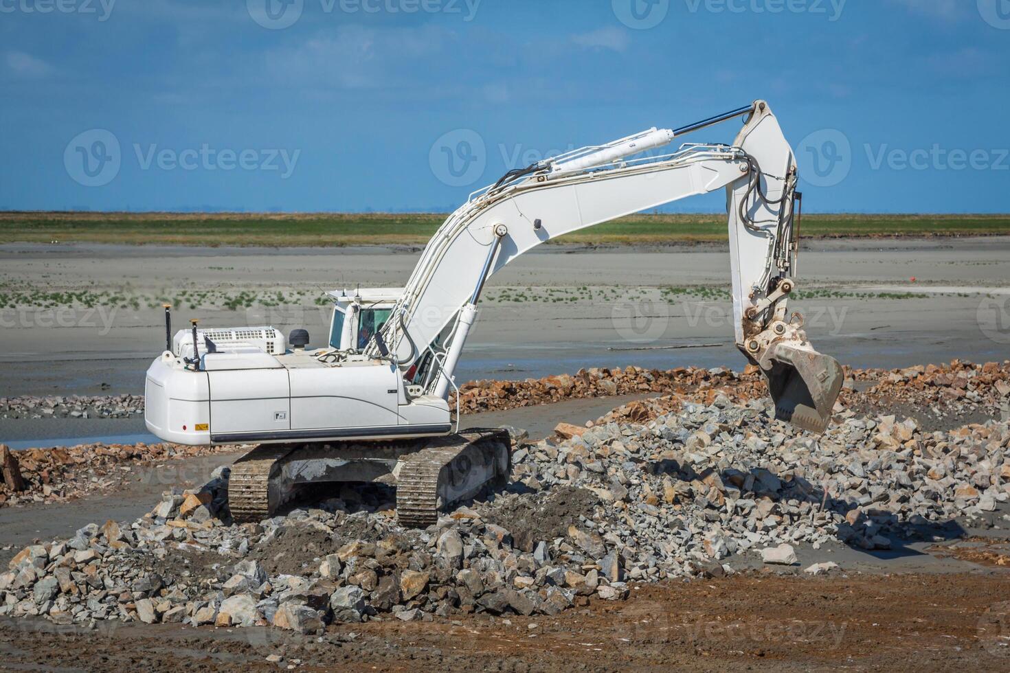 excavator on new construction site photo