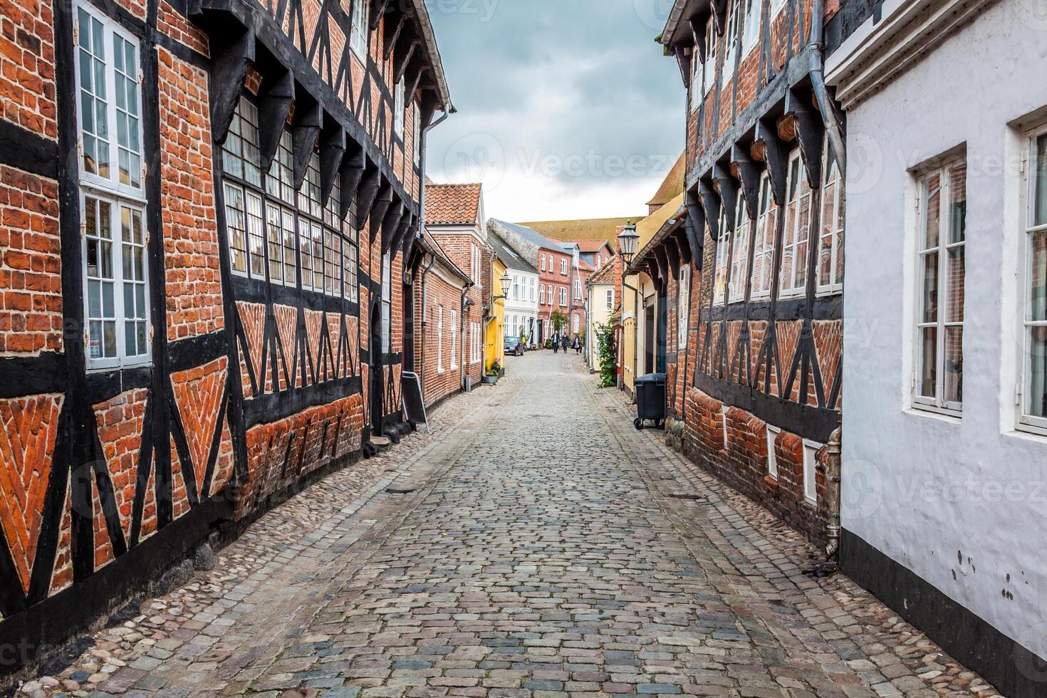 Street with old houses from royal town Ribe in Denmark photo