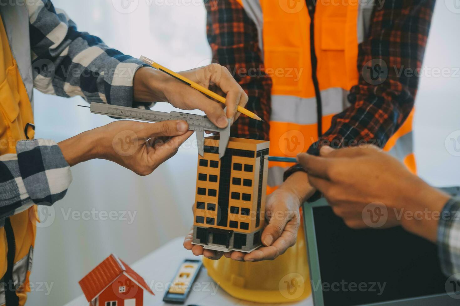 Construction and structure concept of Engineer or architect meeting for project working with partner and engineering tools on model building and blueprint in working site, contract for both companies. photo