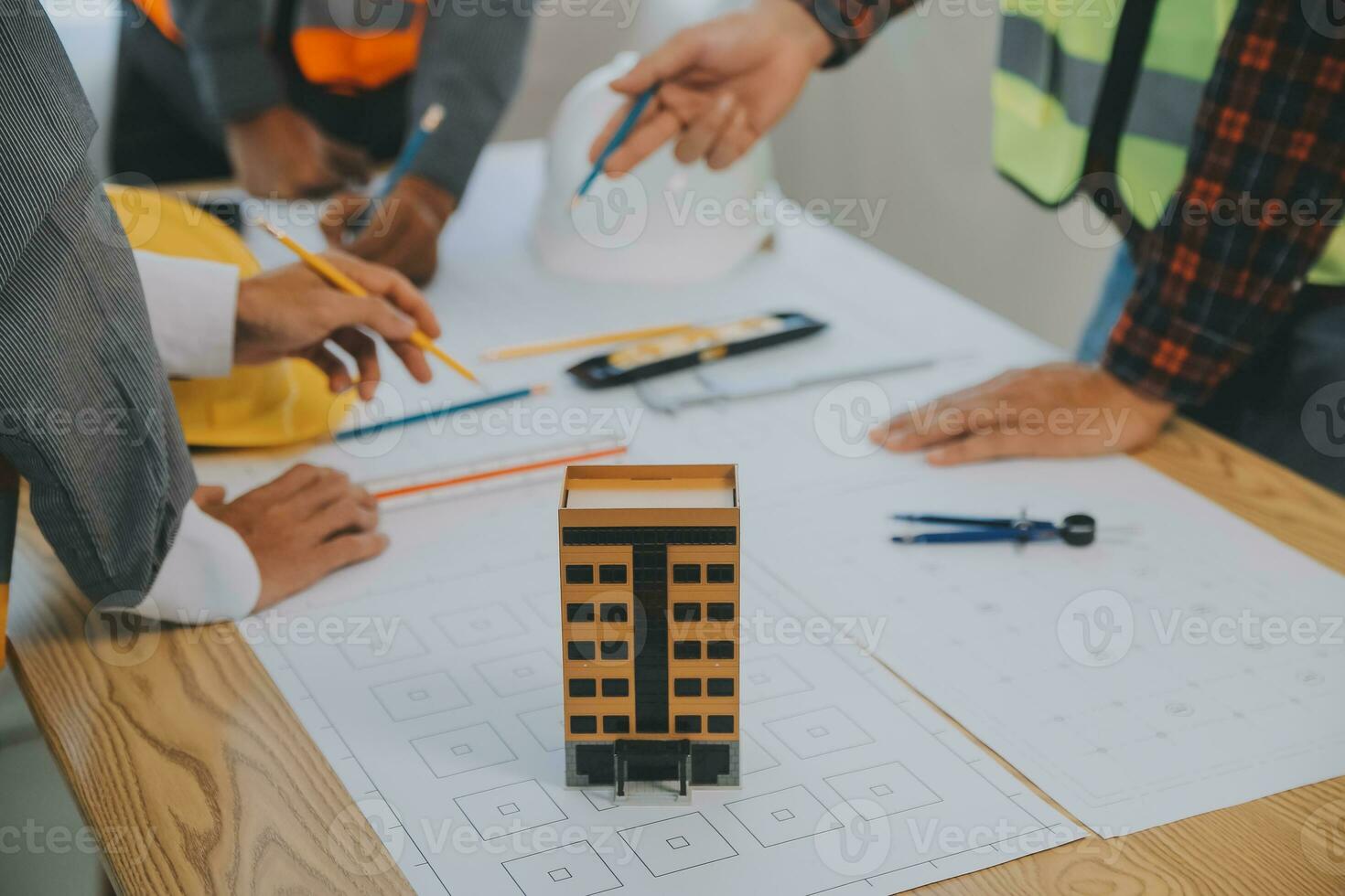 Construction and structure concept of Engineer or architect meeting for project working with partner and engineering tools on model building and blueprint in working site, contract for both companies. photo