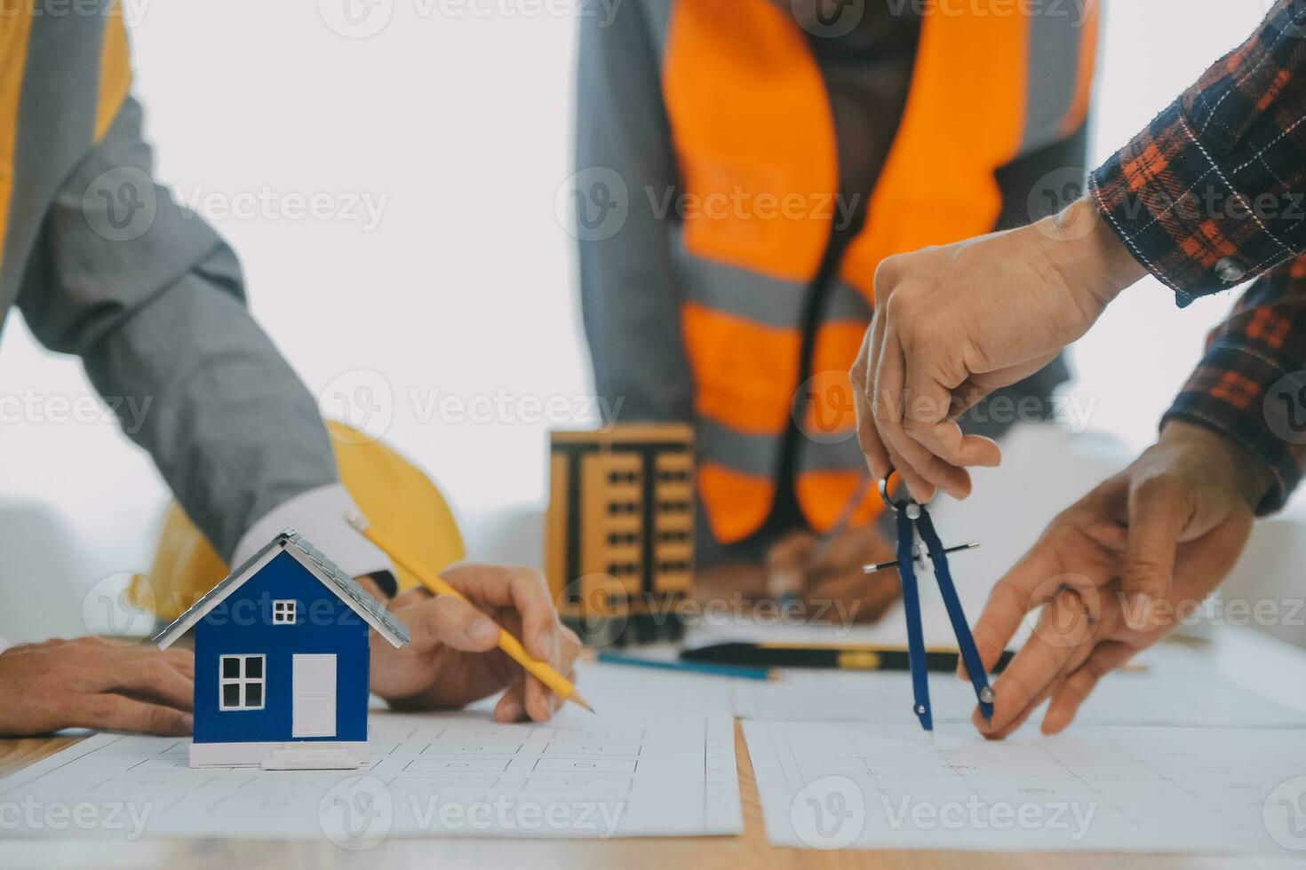 Construction and structure concept of Engineer or architect meeting for project working with partner and engineering tools on model building and blueprint in working site, contract for both companies. photo