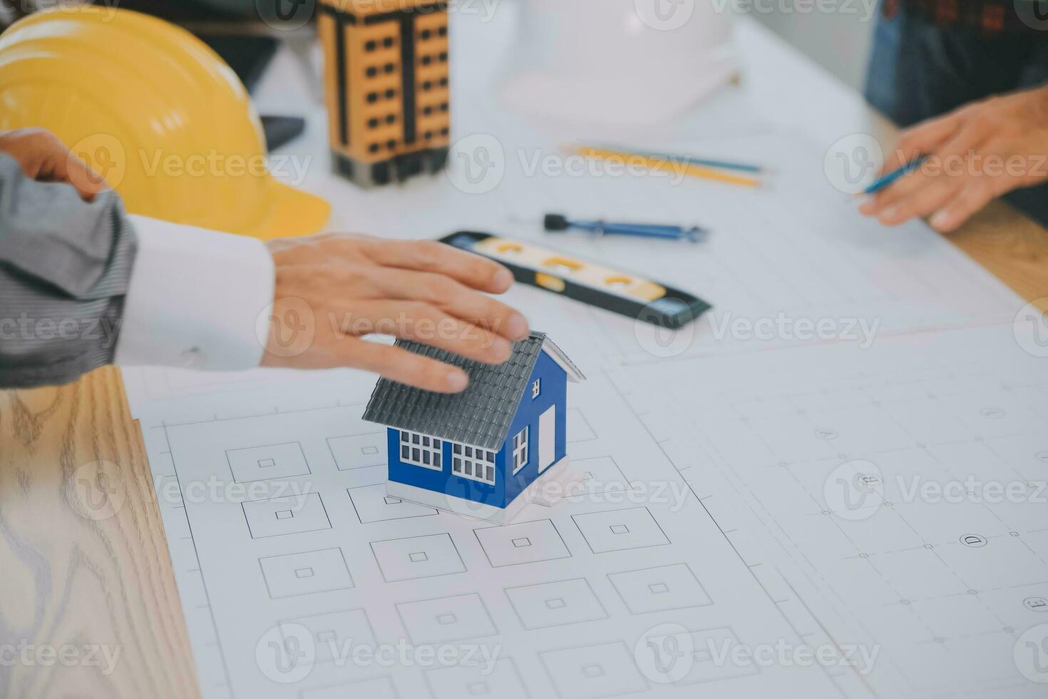 Construction and structure concept of Engineer or architect meeting for project working with partner and engineering tools on model building and blueprint in working site, contract for both companies. photo