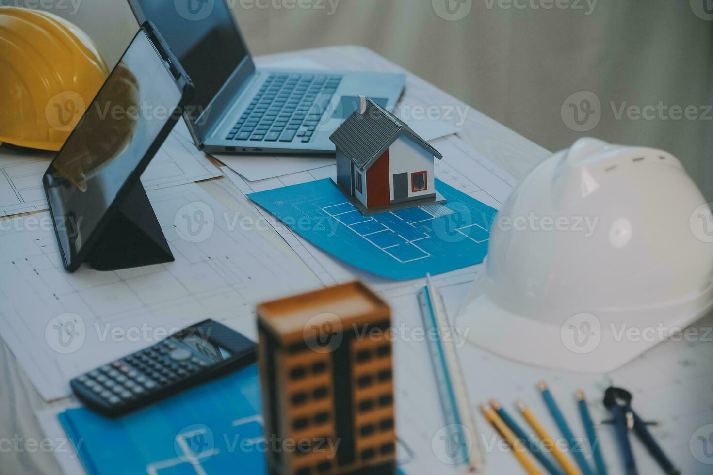 Construction and structure concept of Engineer or architect meeting for project working with partner and engineering tools on model building and blueprint in working site, contract for both companies. photo