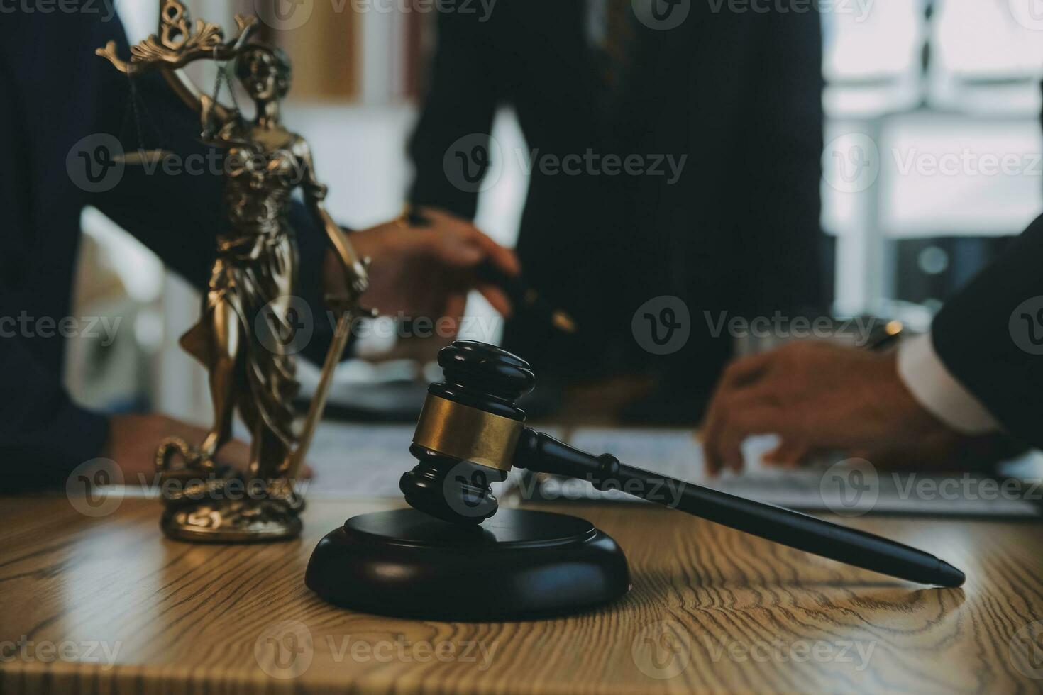 Consultation and conference of Male lawyers and professional businesswoman working and discussion having at law firm in office. Concepts of law, Judge gavel with scales of justice. photo