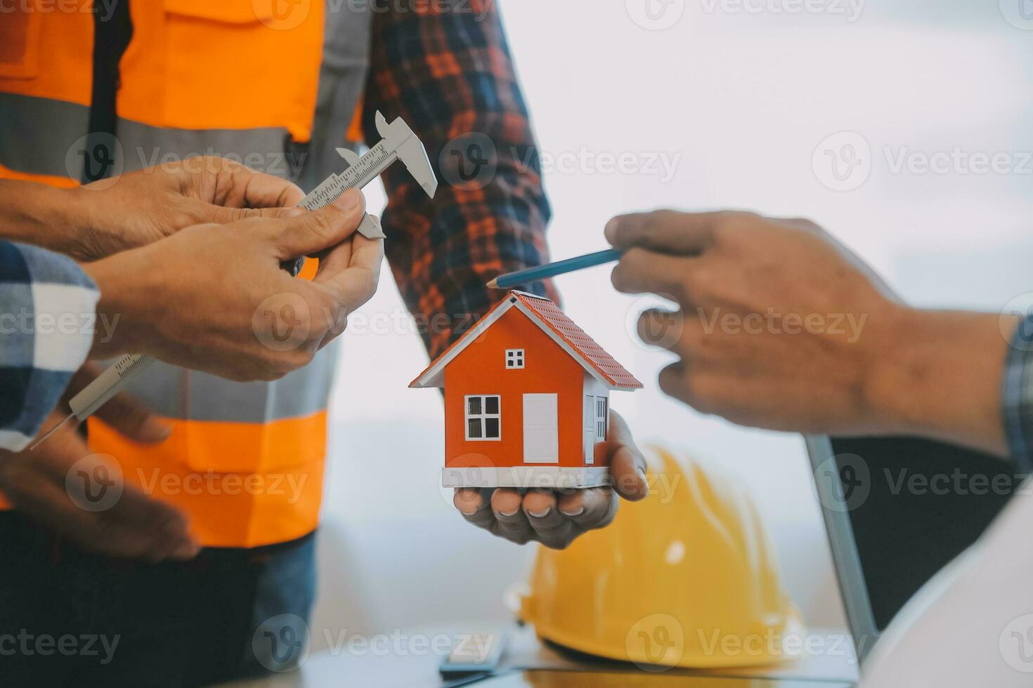 Construction and structure concept of Engineer or architect meeting for project working with partner and engineering tools on model building and blueprint in working site, contract for both companies. photo