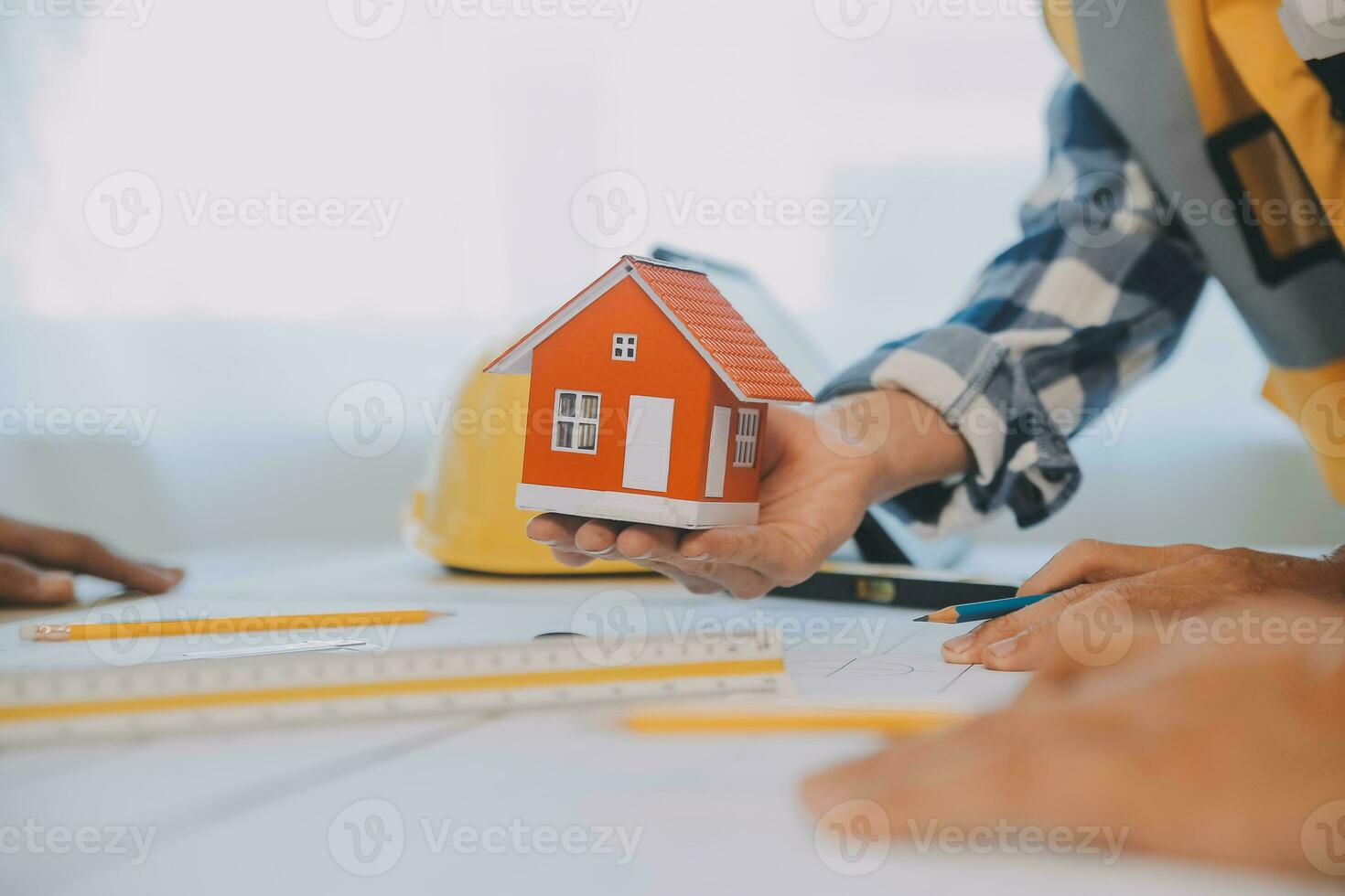 Construction and structure concept of Engineer or architect meeting for project working with partner and engineering tools on model building and blueprint in working site, contract for both companies. photo