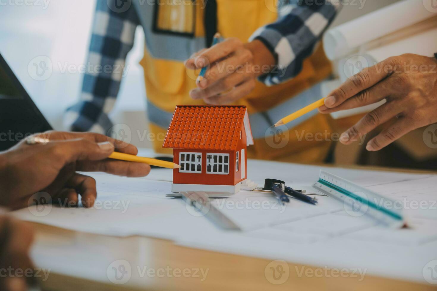 Construction and structure concept of Engineer or architect meeting for project working with partner and engineering tools on model building and blueprint in working site, contract for both companies. photo