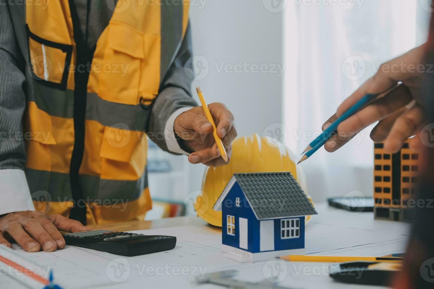 Construction and structure concept of Engineer or architect meeting for project working with partner and engineering tools on model building and blueprint in working site, contract for both companies. photo