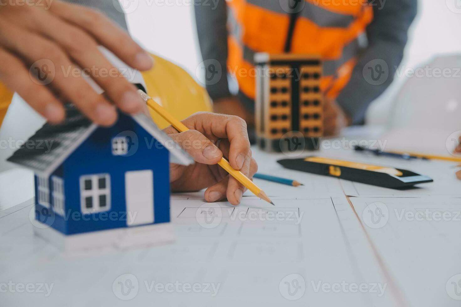 Construction and structure concept of Engineer or architect meeting for project working with partner and engineering tools on model building and blueprint in working site, contract for both companies. photo