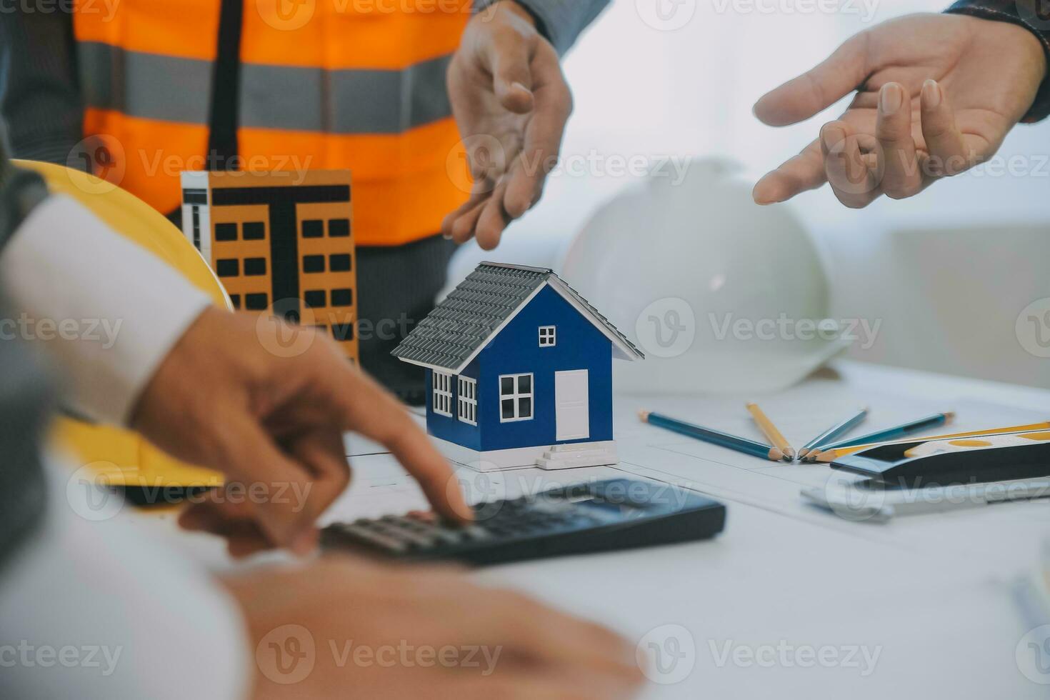 Construction and structure concept of Engineer or architect meeting for project working with partner and engineering tools on model building and blueprint in working site, contract for both companies. photo