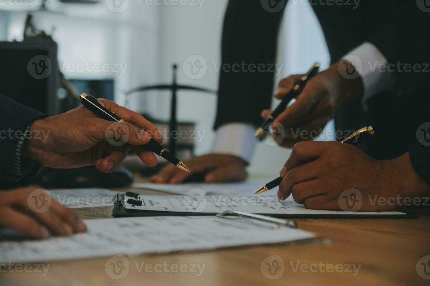 Consultation and conference of Male lawyers and professional businesswoman working and discussion having at law firm in office. Concepts of law, Judge gavel with scales of justice. photo