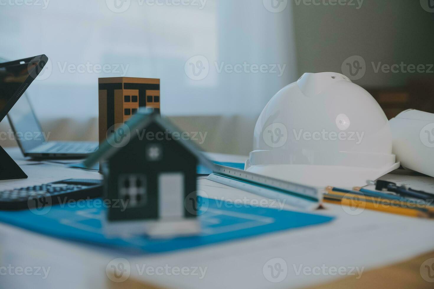 Construction and structure concept of Engineer or architect meeting for project working with partner and engineering tools on model building and blueprint in working site, contract for both companies. photo
