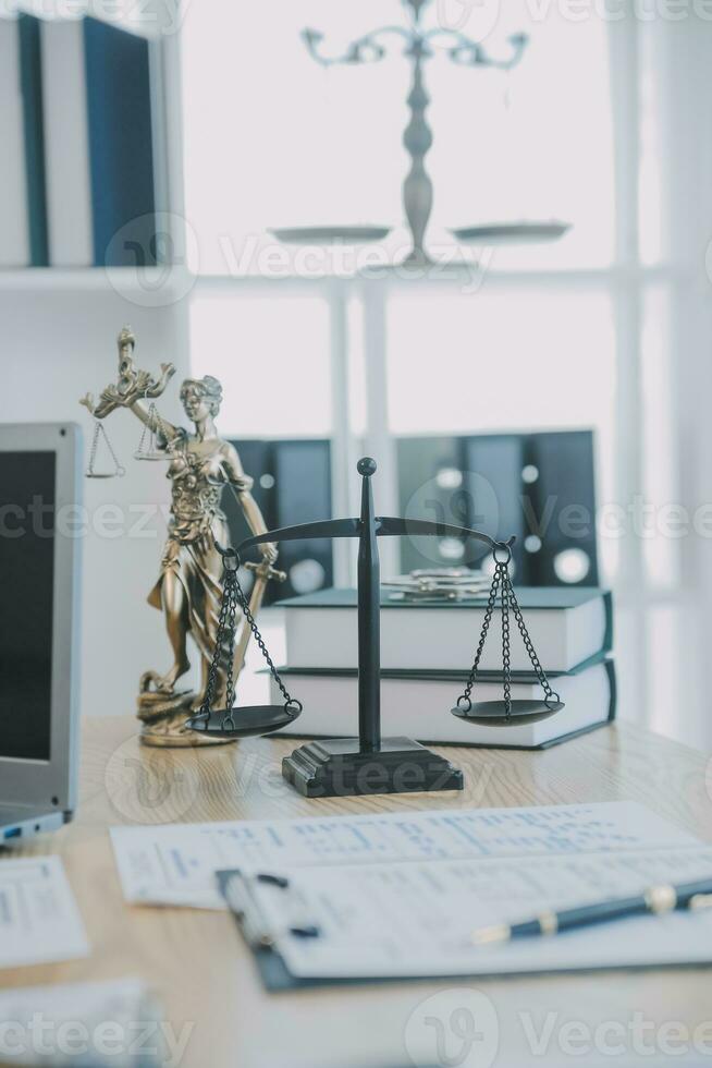 Consultation and conference of Male lawyers and professional businesswoman working and discussion having at law firm in office. Concepts of law, Judge gavel with scales of justice. photo