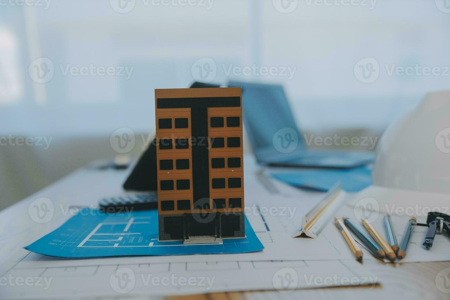 Construction and structure concept of Engineer or architect meeting for project working with partner and engineering tools on model building and blueprint in working site, contract for both companies. photo