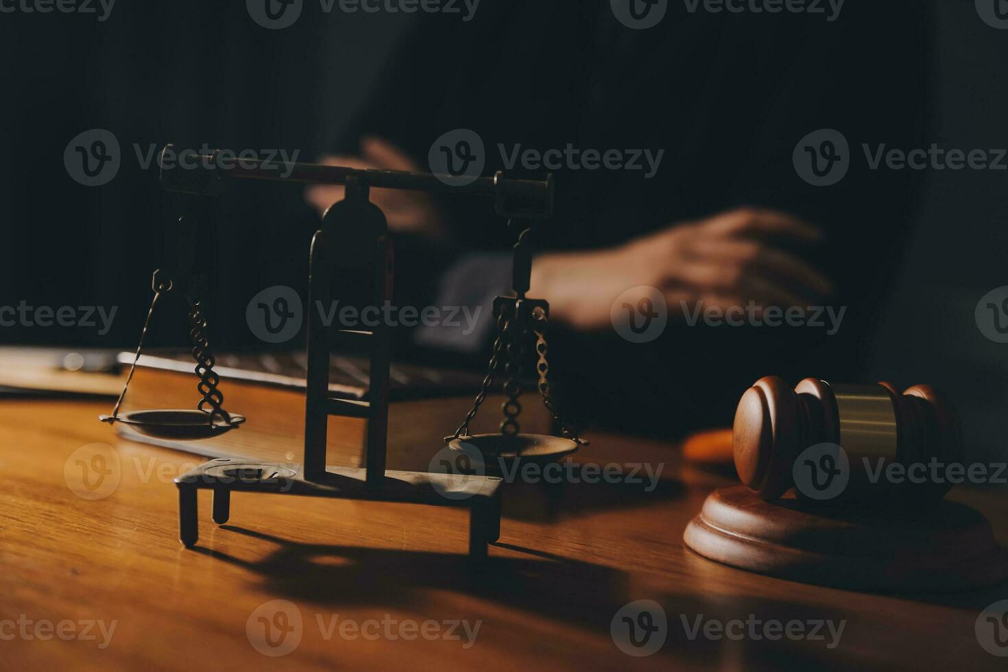 Business and lawyers discussing contract papers with brass scale on desk in office. Law, legal services, advice, justice and law concept picture with film grain effect photo