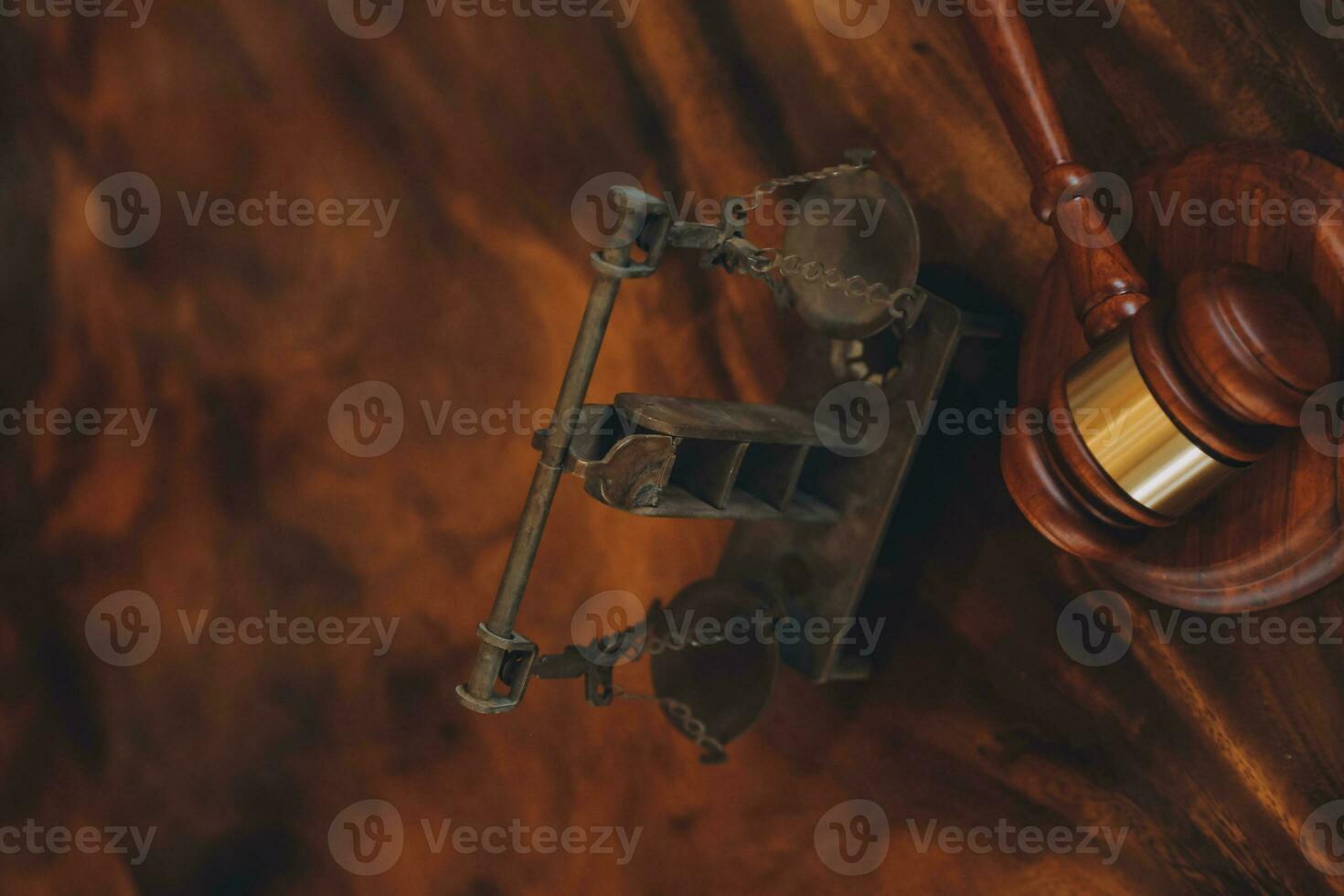 Justice and law concept.Male judge in a courtroom with the gavel, working with, computer and docking keyboard, eyeglasses, on table in morning light photo