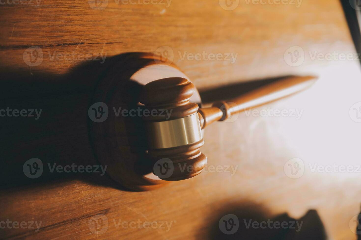 Business and lawyers discussing contract papers with brass scale on desk in office. Law, legal services, advice, justice and law concept picture with film grain effect photo