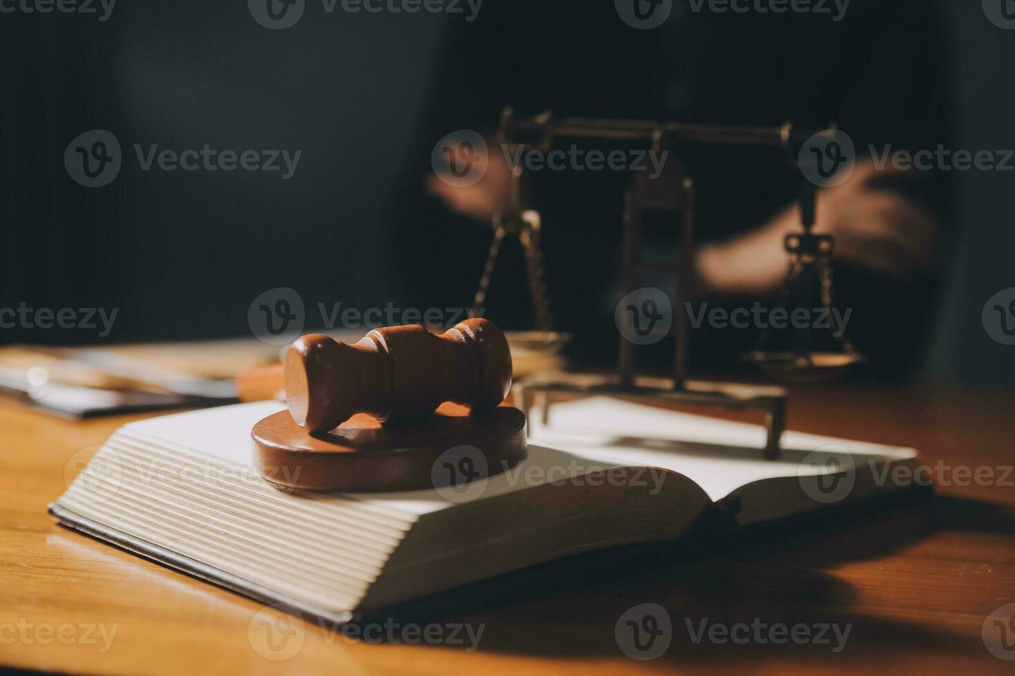 Business and lawyers discussing contract papers with brass scale on desk in office. Law, legal services, advice, justice and law concept picture with film grain effect photo