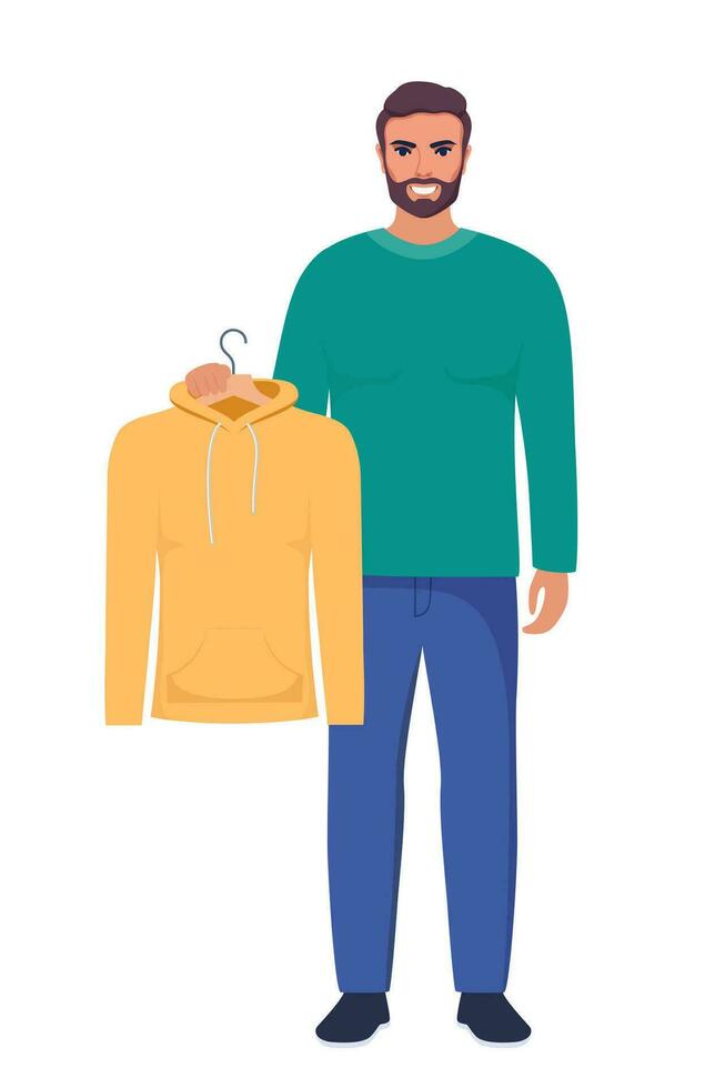 sonriente joven hombre participación percha con amarillo sudadera con capucha. elegir ropa concepto. vector ilustración en plano estilo.
