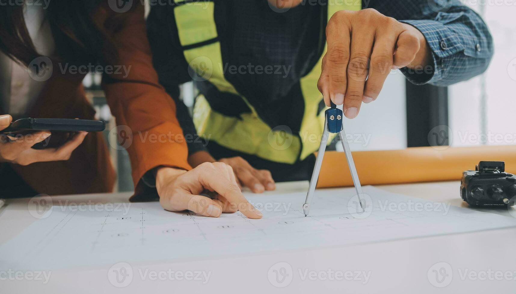 Engineer Teamwork Meeting, Drawing working on blueprint meeting for project working with partner on model building and engineering tools in working site, Construction and structure concept. photo