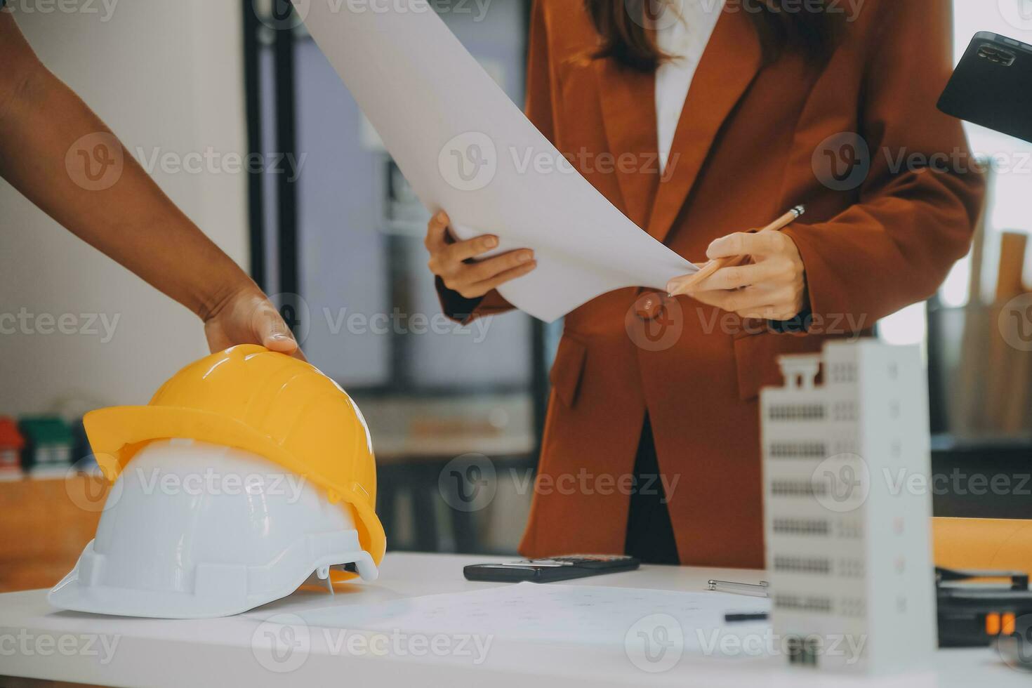 Engineer Teamwork Meeting, Drawing working on blueprint meeting for project working with partner on model building and engineering tools in working site, Construction and structure concept. photo