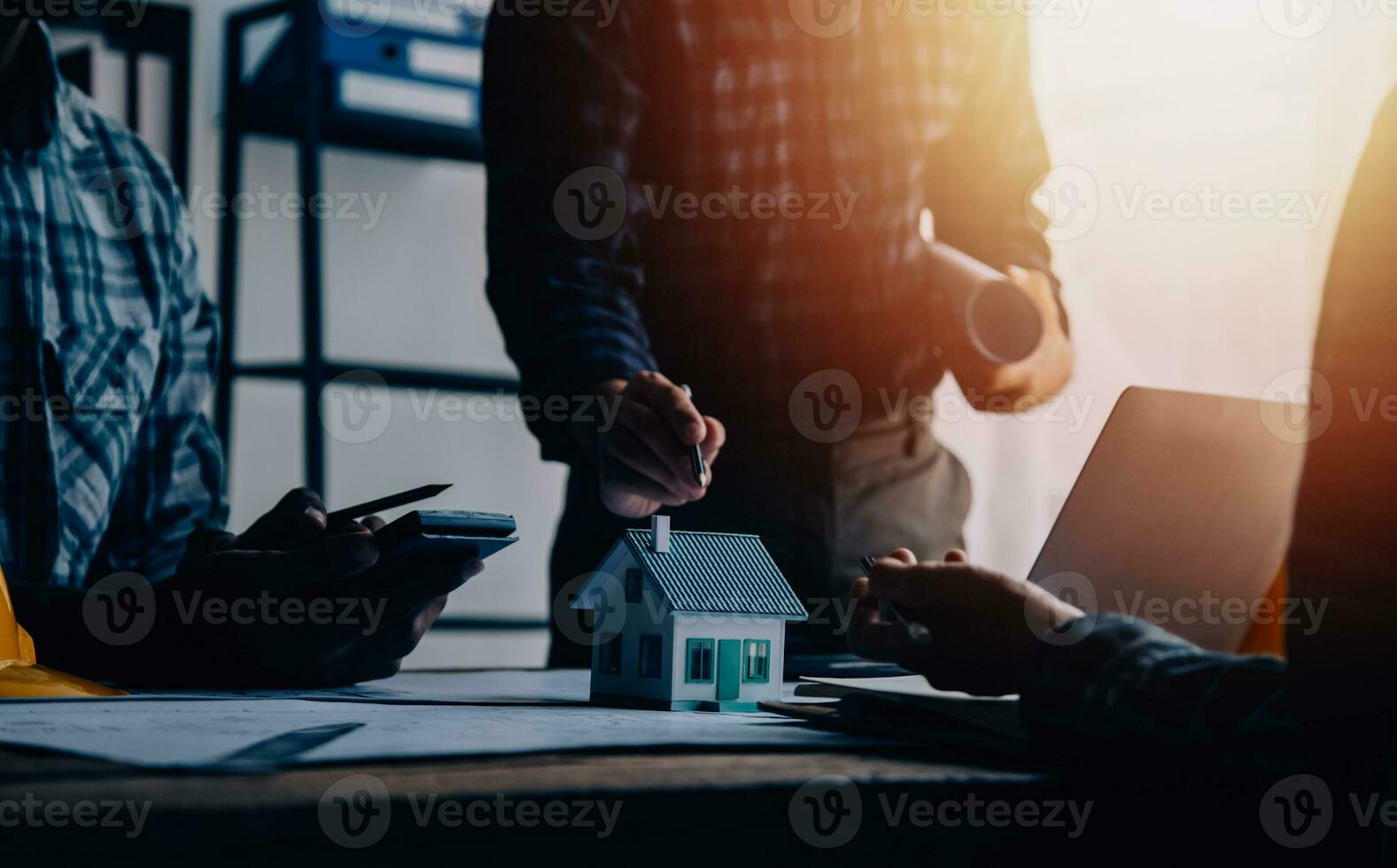 Construction and structure concept of Engineer or architect meeting for project working with partner and engineering tools on model building and blueprint in working site, contract for both companies. photo