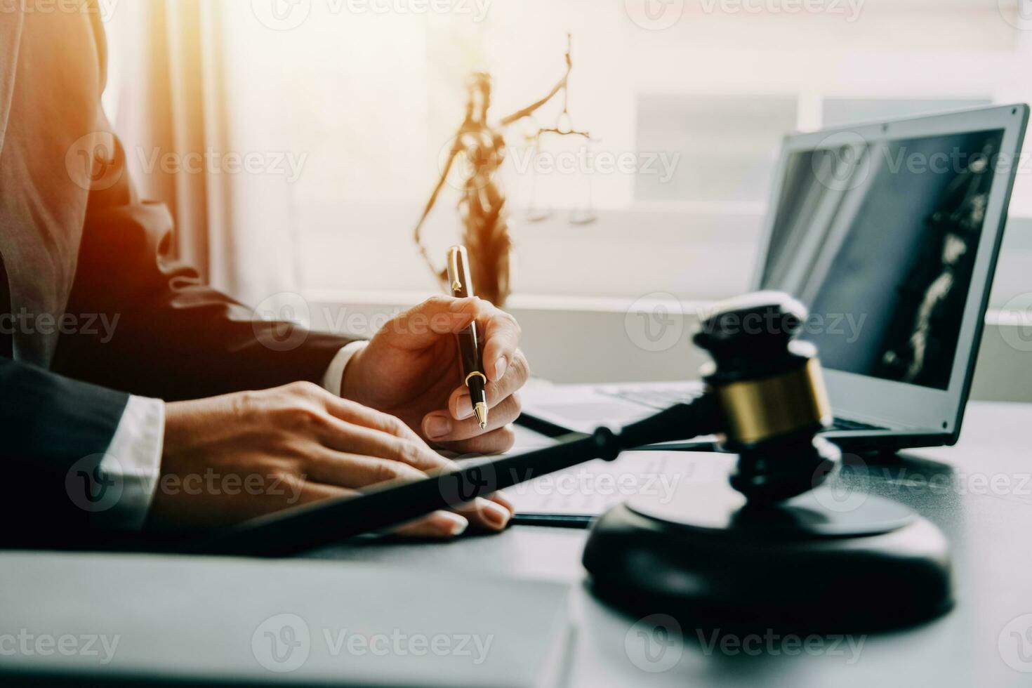 Business and lawyers discussing contract papers with brass scale on desk in office. Law, legal services, advice, justice and law concept picture with film grain effect photo