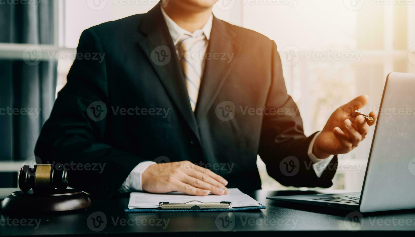 Business and lawyers discussing contract papers with brass scale on desk in office. Law, legal services, advice, justice and law concept picture with film grain effect photo