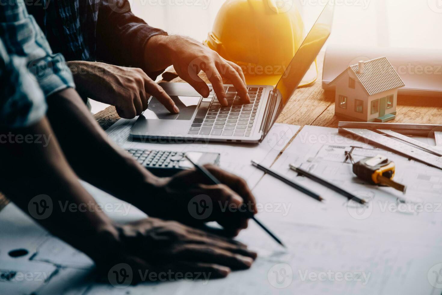 Construction and structure concept of Engineer or architect meeting for project working with partner and engineering tools on model building and blueprint in working site, contract for both companies. photo