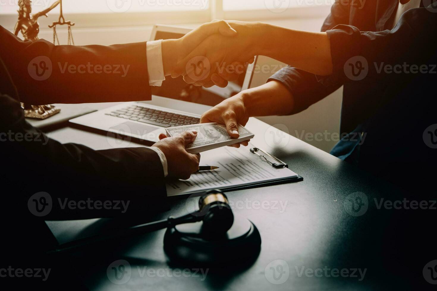 Business and lawyers discussing contract papers with brass scale on desk in office. Law, legal services, advice, justice and law concept picture with film grain effect photo