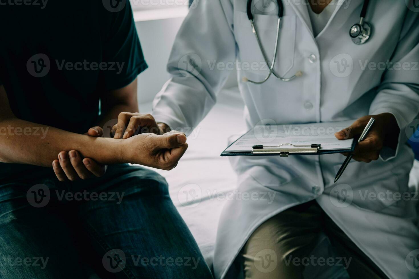 Doctor telling to patient woman the results of her medical tests. Doctor showing medical records to cancer patient in hospital ward. Senior doctor explaint the side effects of the intervention. photo