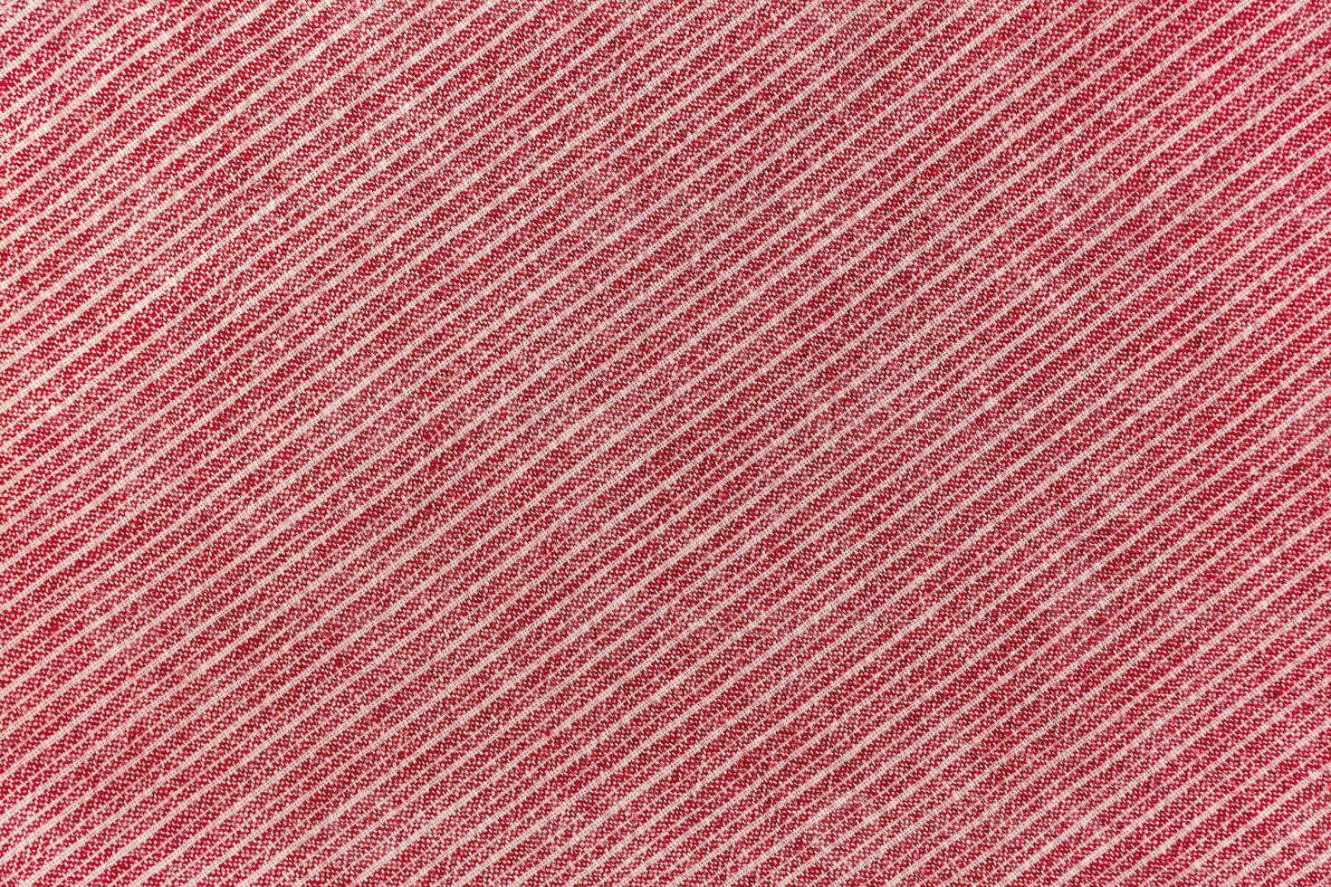 Natural red linen texture with striped diagonal pattern as background, wallpaper photo