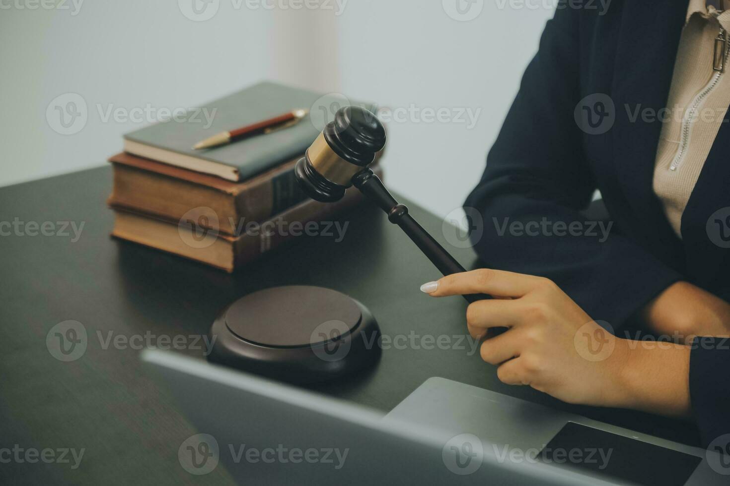 Judge gavel with Justice lawyers having team meeting at law firm background. Concepts of Law and Legal services. photo