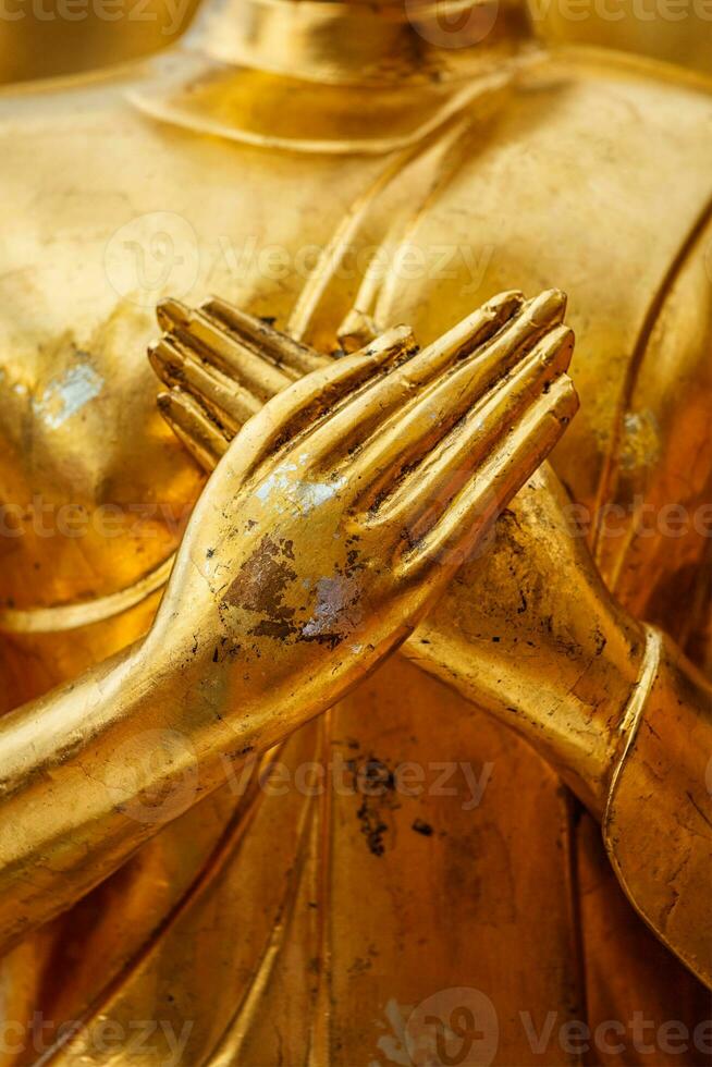 Buddha statue hands close up photo