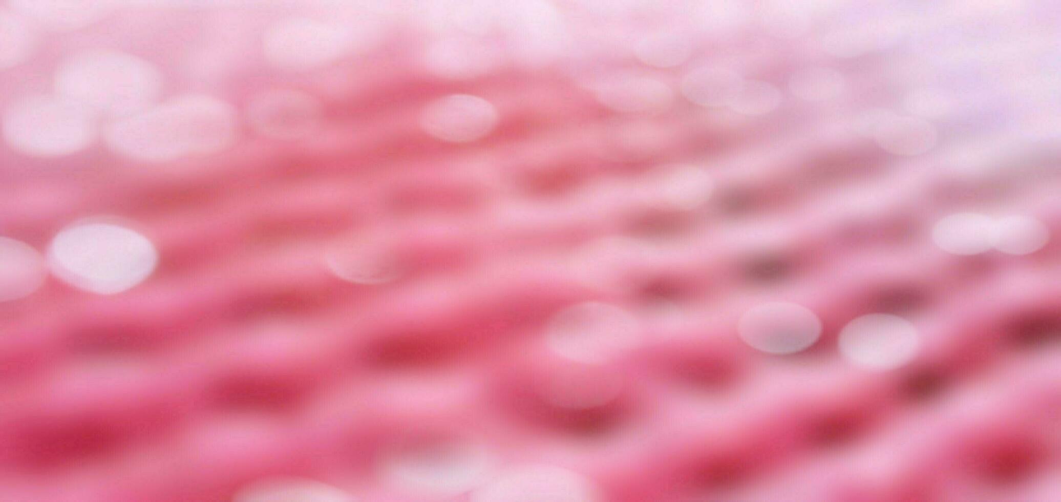 rosado resumen fondo, rosado bokeh fondo, borroso y ligero bokeh antecedentes. foto