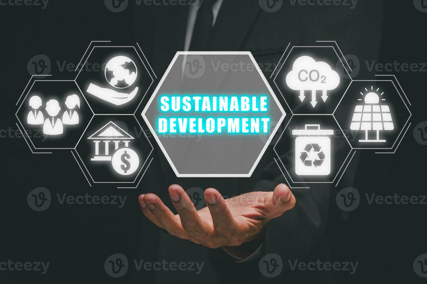 Sustainable develpment concept, Businessman hand holding sustainable develpment icon on virtual screen. photo