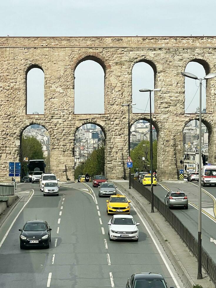 15 of April 2023 - Istanbul, Turkey - The Valens Aqueduct is part of the water supply system of Constantinople. Located in the old part of Istanbul on Ataturk Boulevard. photo