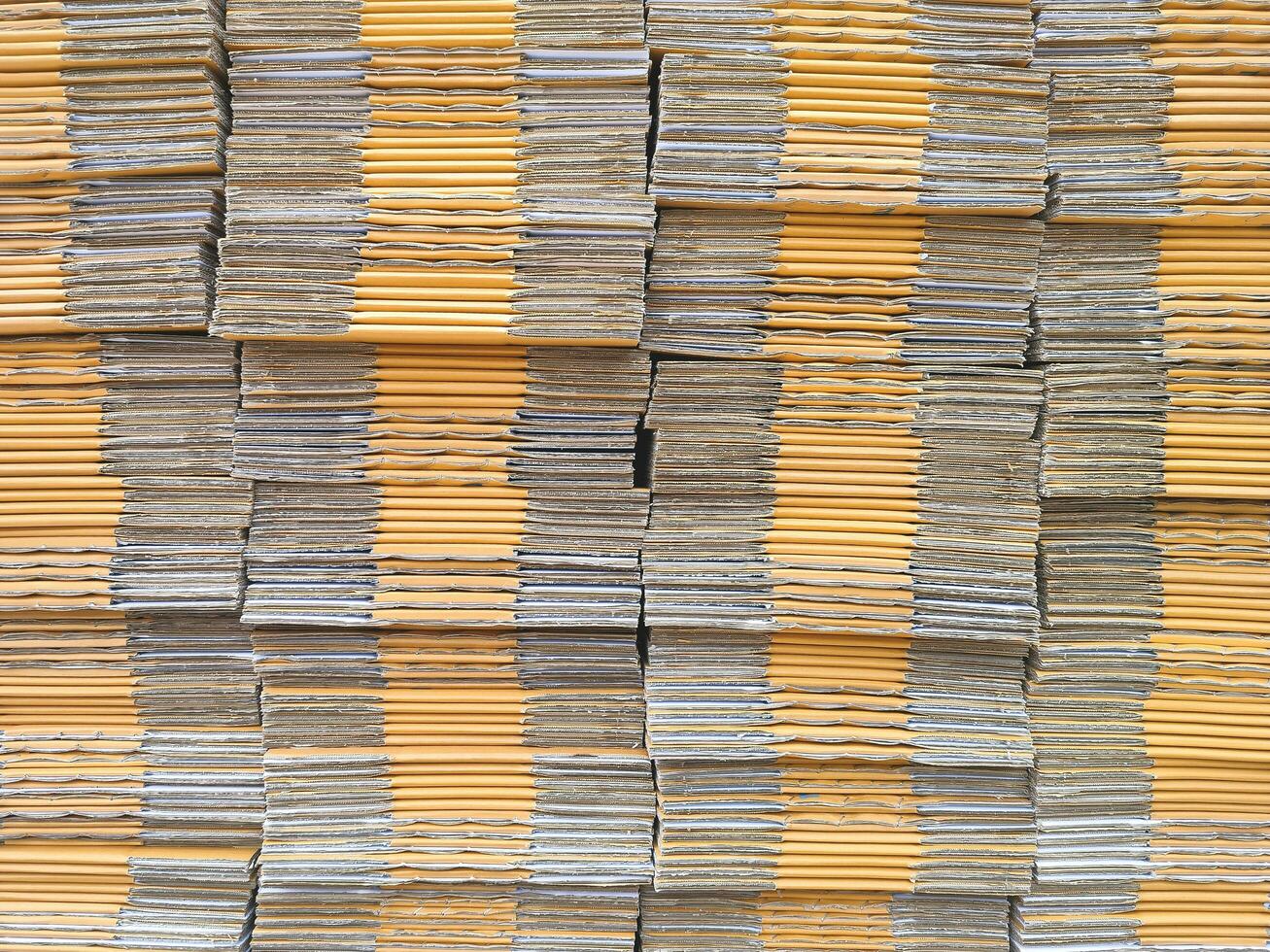 Background of many brown foldable cardboard boxes stack for packaging photo