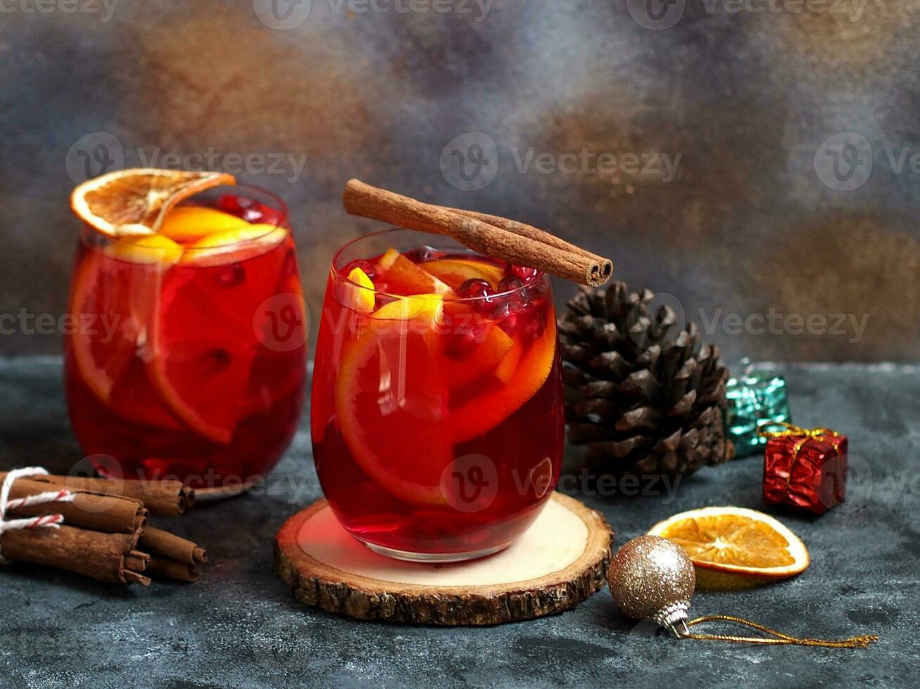 Festive Christmas sangria or mulled wine drinks with citrus fruit and cinnamon spices photo