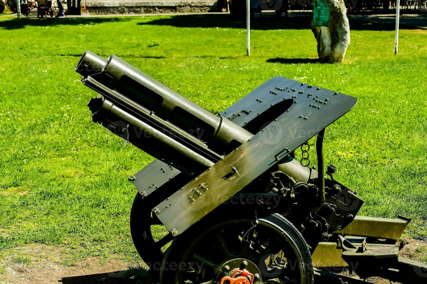 a large cannon on display in the park photo