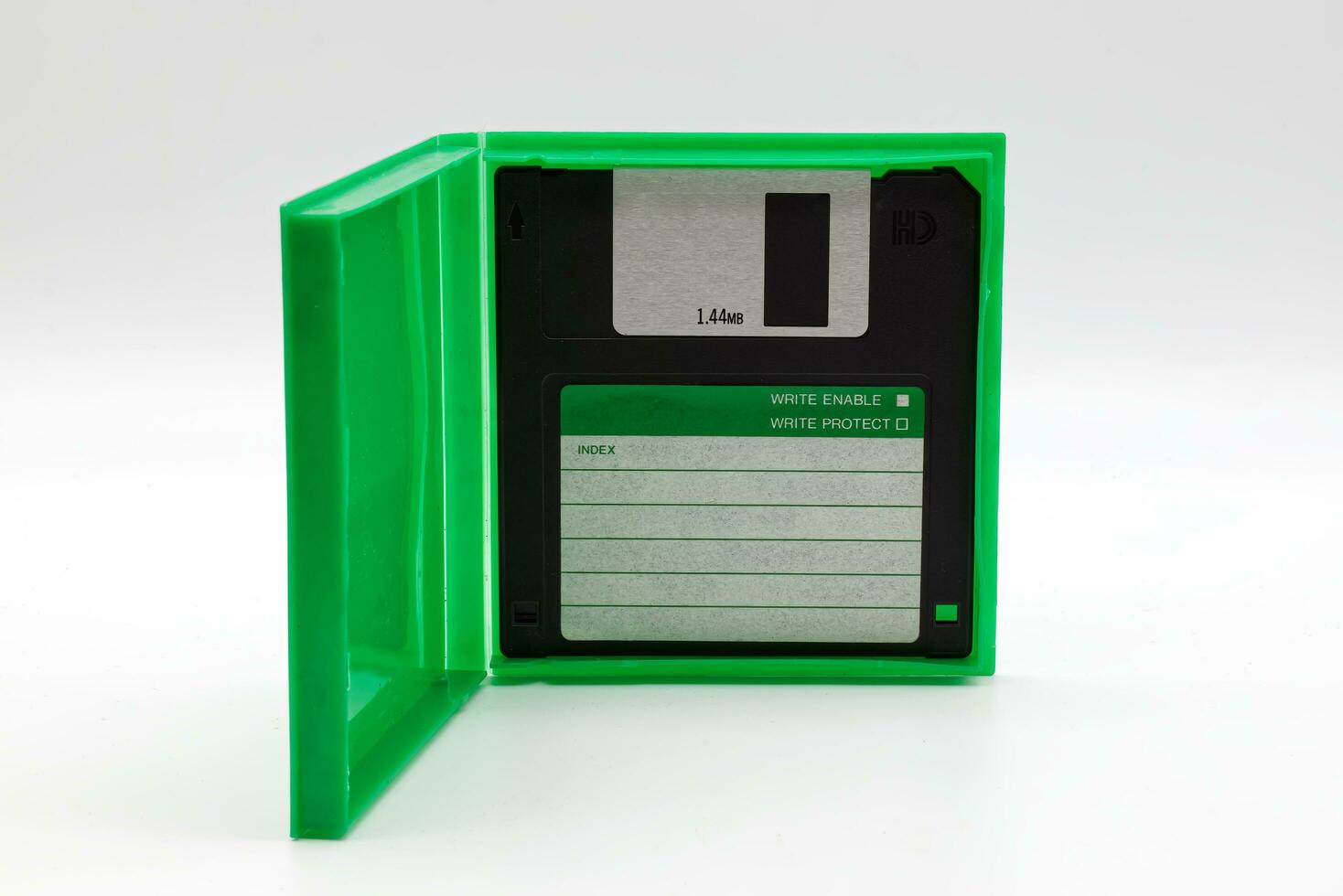 Floppy disk of 1.4 megabytes isolated on white background. Vintage storage for computer. photo