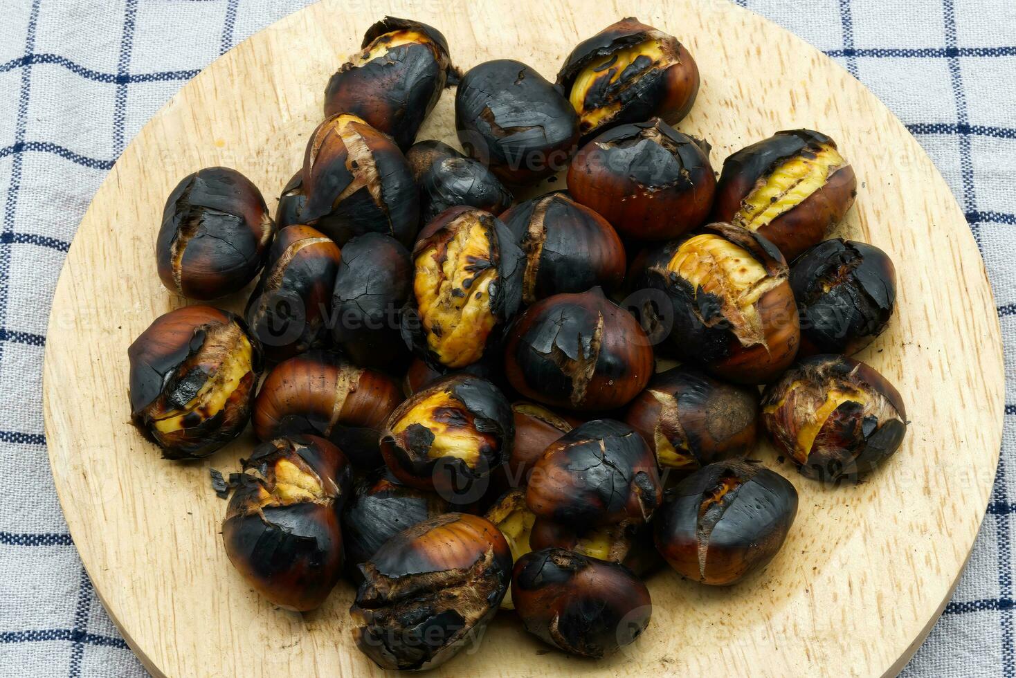 Fresh roasted chestnuts on a table. Top view photo