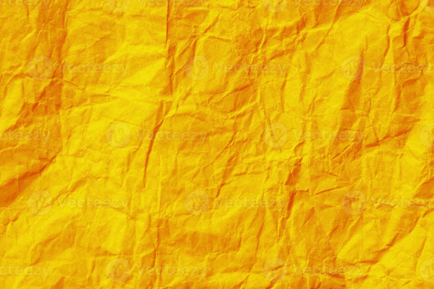Wrinkled yellow paper texture background. Crumpled paper surface. photo