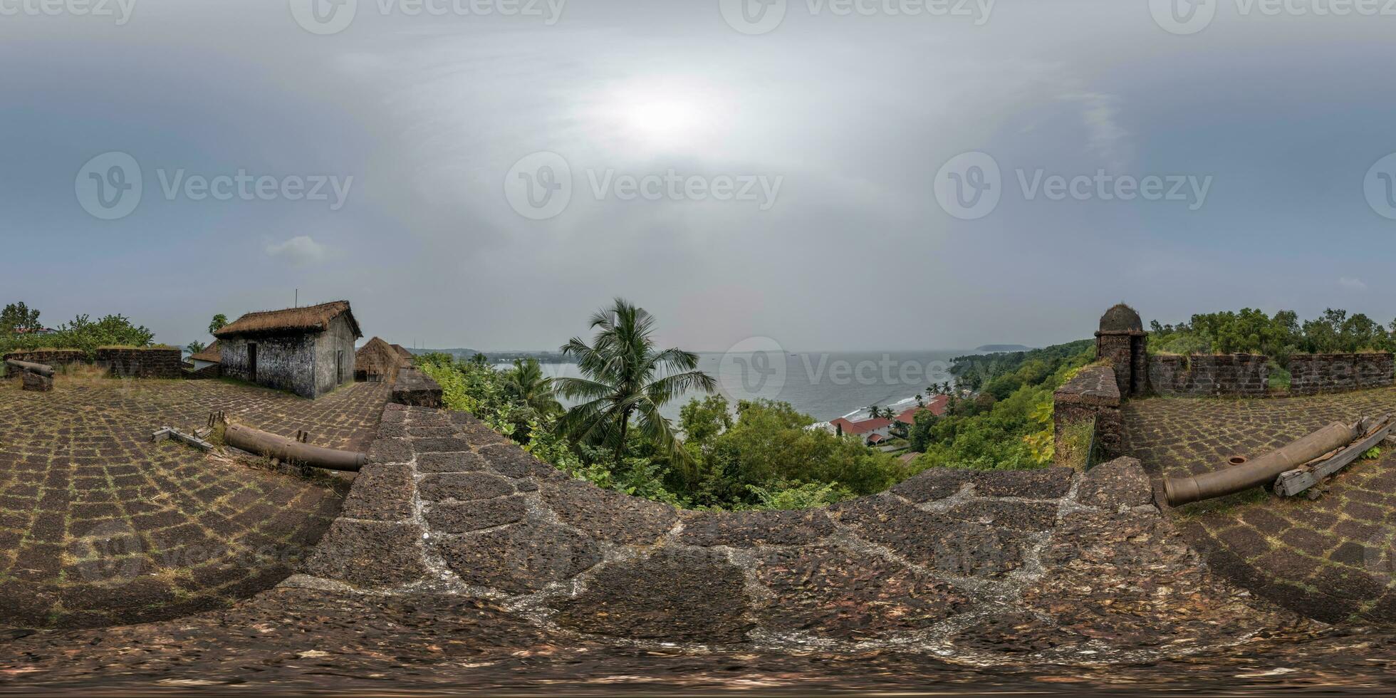 full hdri 360 panorama portuguese defensive abandoned military fortress with old guns on ocean in equirectangular spherical projection with zenith and nadir. VR AR content photo