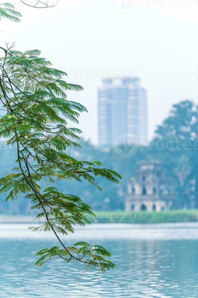 Hoan Kiem Lake - Ho Guom or Sword lake in the center of Hanoi in the fog in the morning. photo